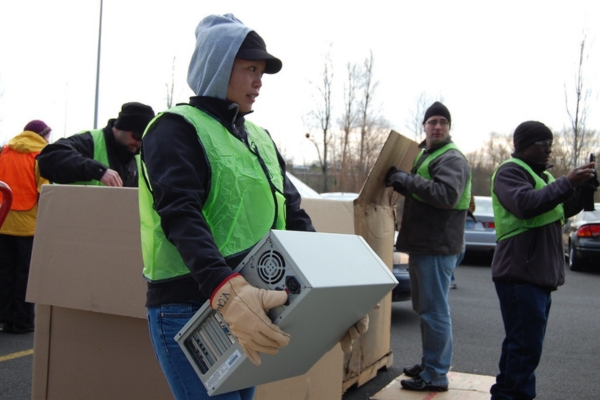 woman carrying e-waste at event